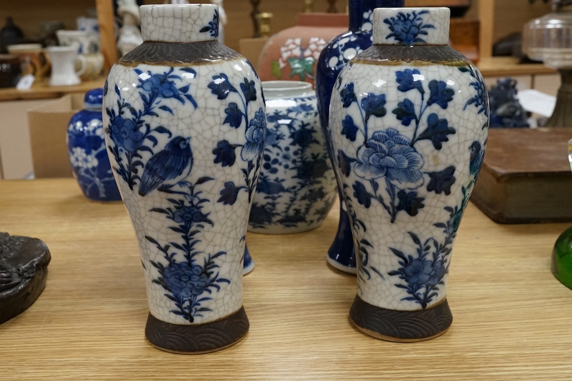 Chinese blue and white porcelain, late 19th century, comprising two prunus vases, two crackle glaze vases and a 'Bird and Flowers' jar, tallest crackle glaze vases 23cm